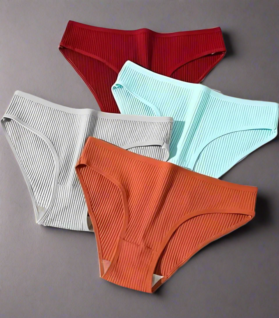 Four pairs of ribbed underwear in red, gray, blue, and orange on a white background.