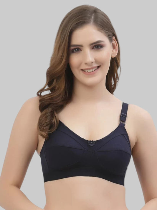Model wearing a black modern non-padded bra with a grey background 